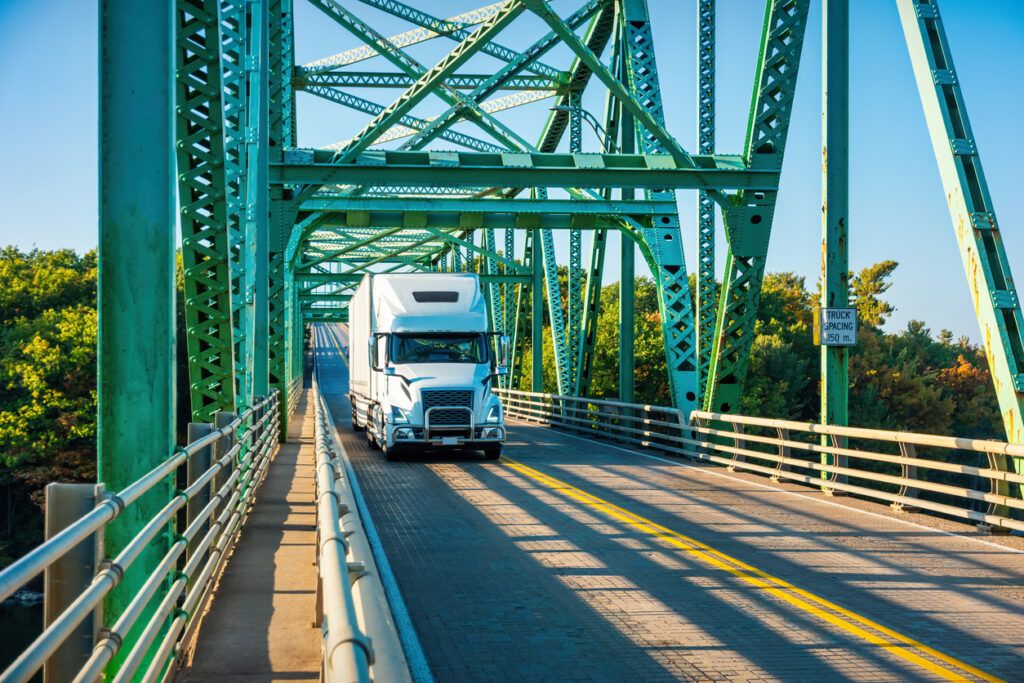 A truck crosses a bridge.