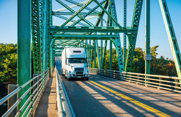 A truck crosses a bridge.