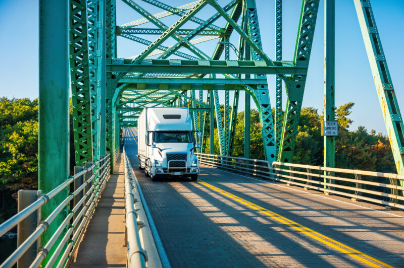 A truck crosses a bridge.