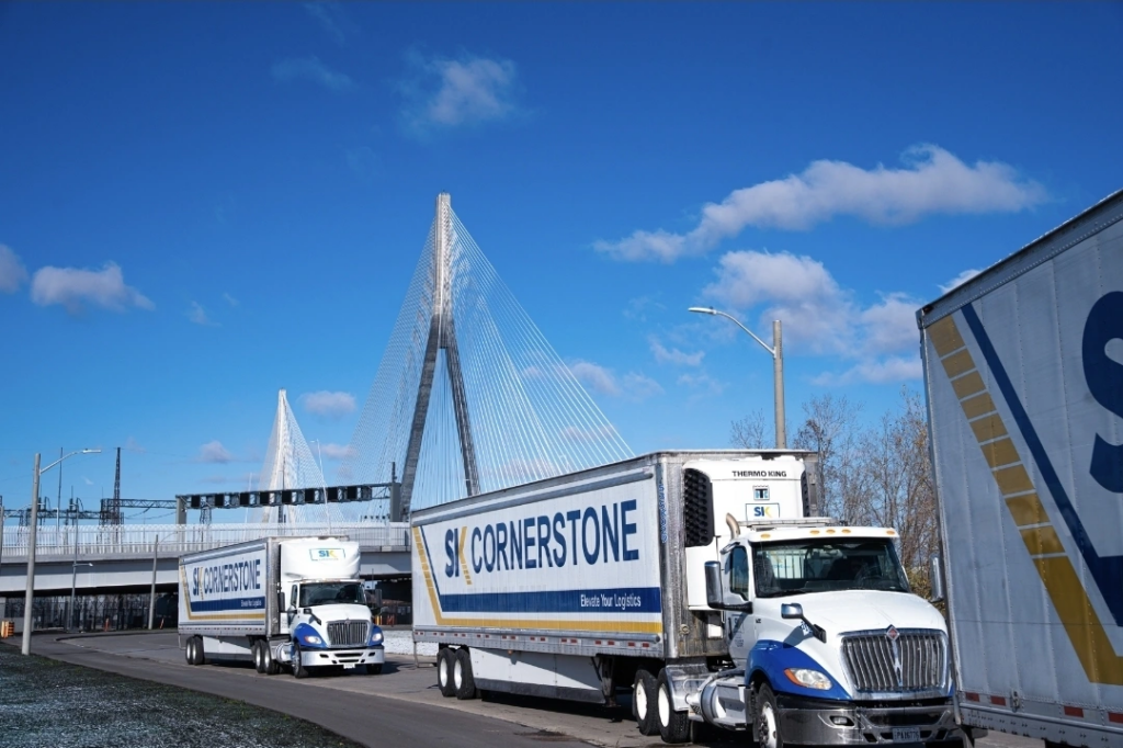 SK Cornerstone trucks and trailers on the Gordie Howe bridge