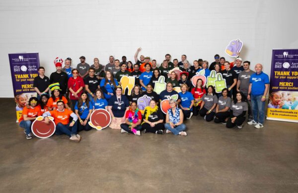 T4C volunteers help pack food for Canadian children article image