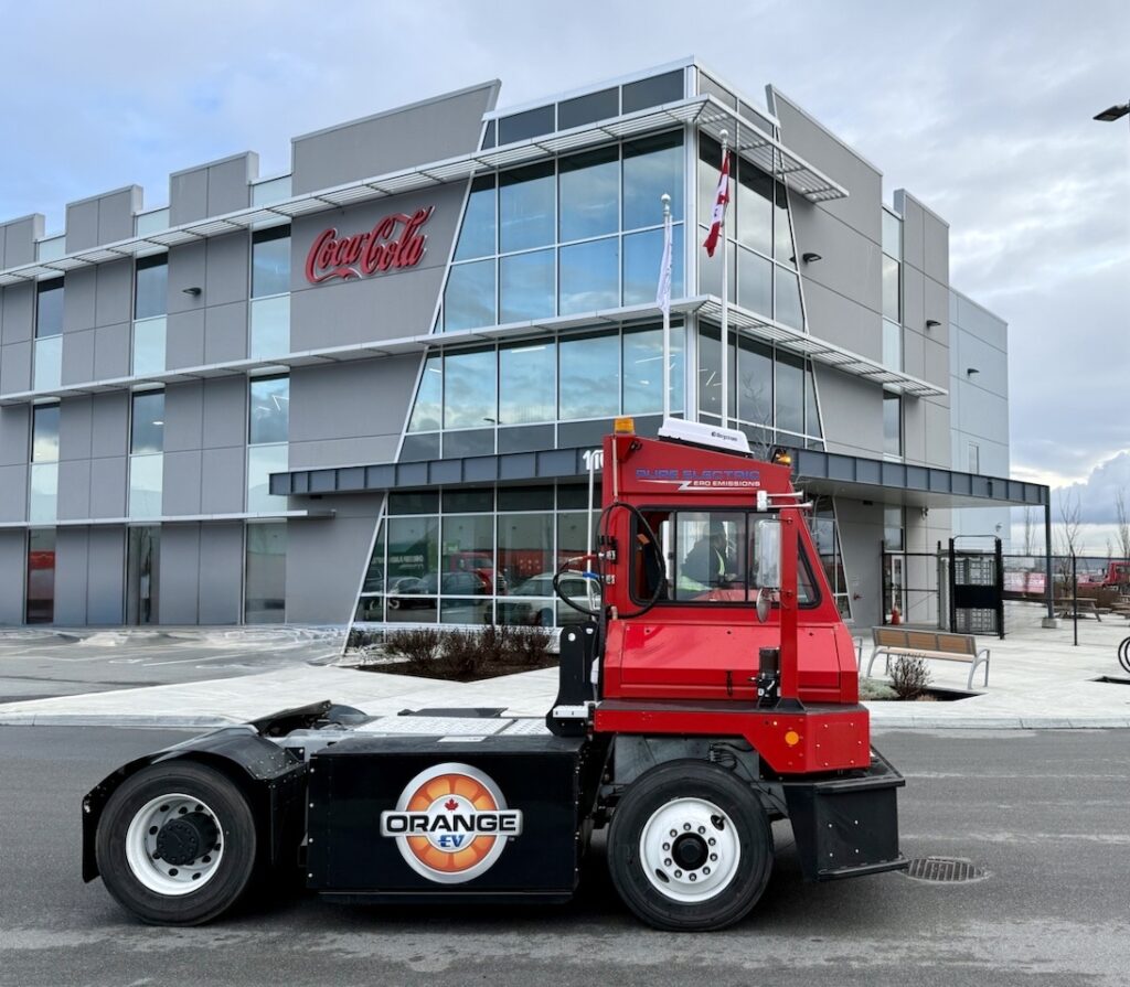 Coca-Cola Canada Bottling Picture of Orange EV yard terminal, branded