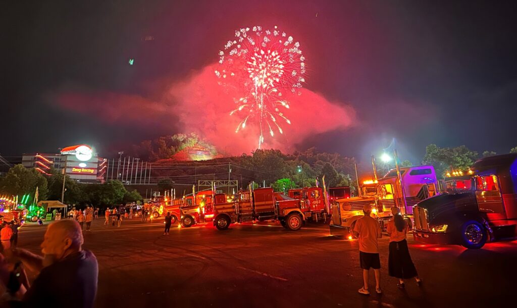 Fireworks above parked trucks