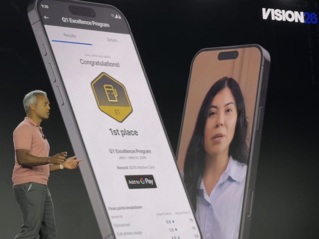 Company's chief product officer on stage presenting Motive AI coach 