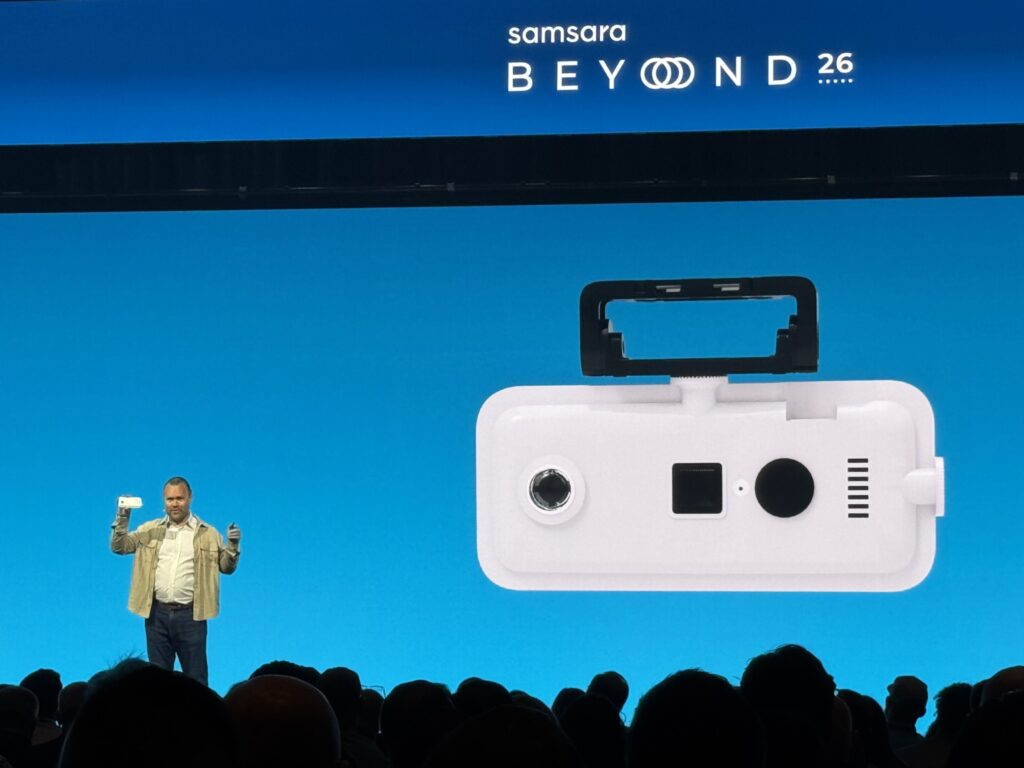 Johan Land on stage holding the new 360-degree camera during the presentation