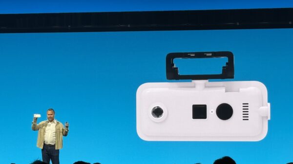 Johan Land on stage holding the new 360-degree camera during the presentation