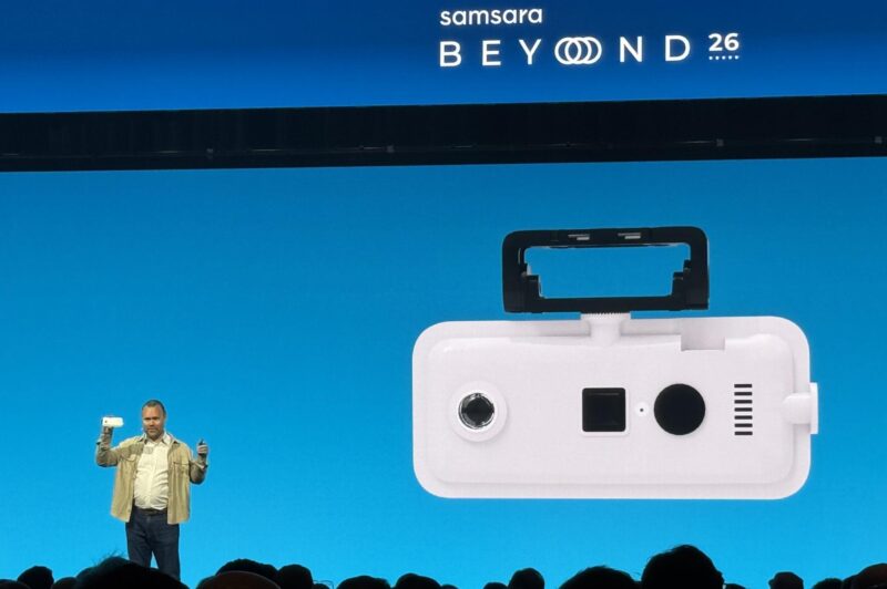 Johan Land on stage holding the new 360-degree camera during the presentation