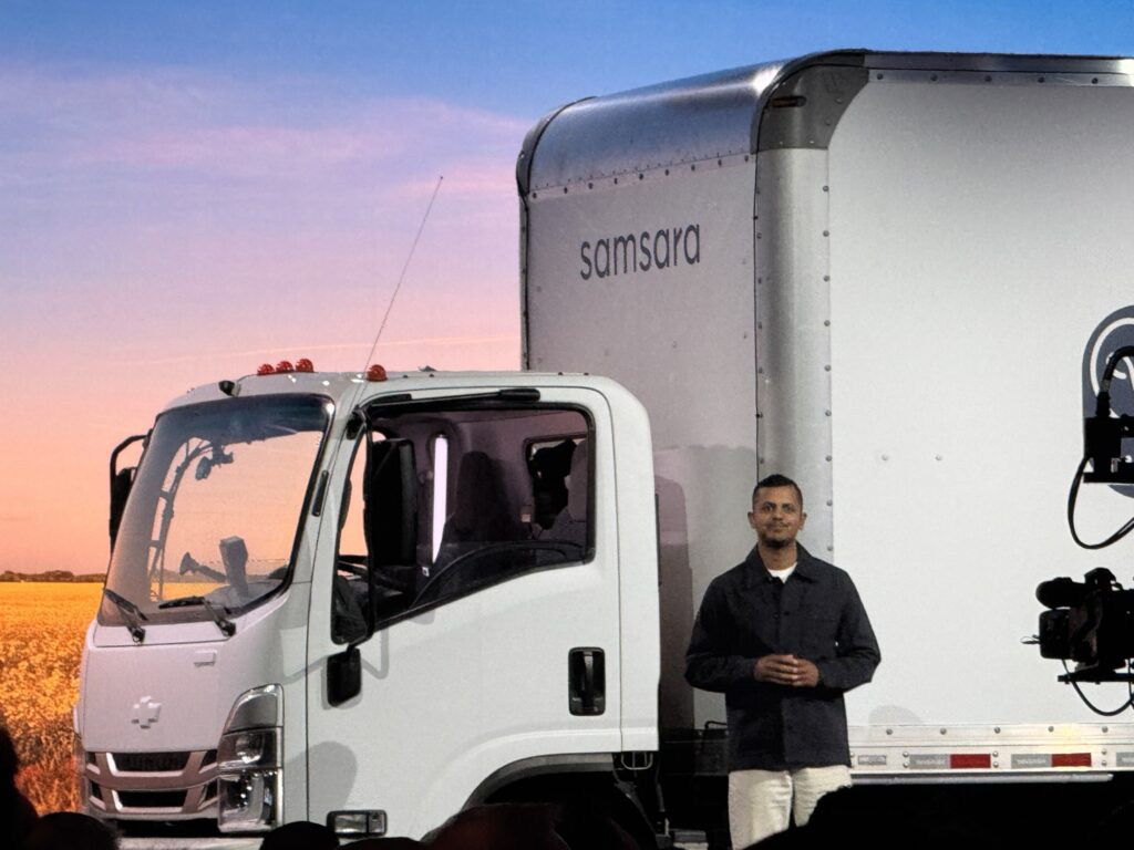 Arpan Podduturi near the truck on stage