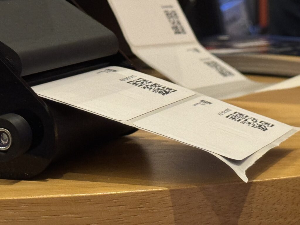 a picture of a tracking label comming out of the printer 