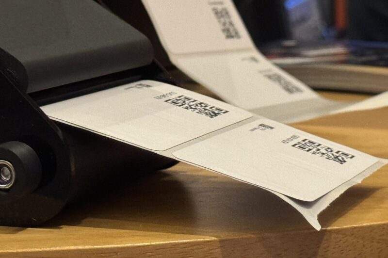 a picture of a tracking label comming out of the printer