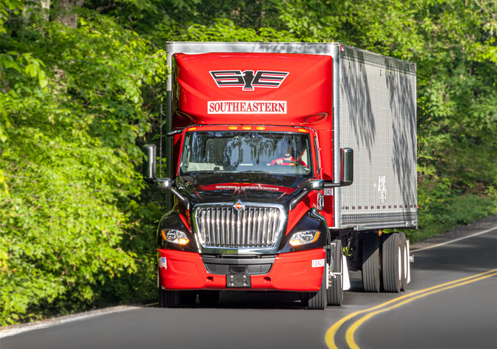 Red International Southeastern Freight Lines truck on the road  