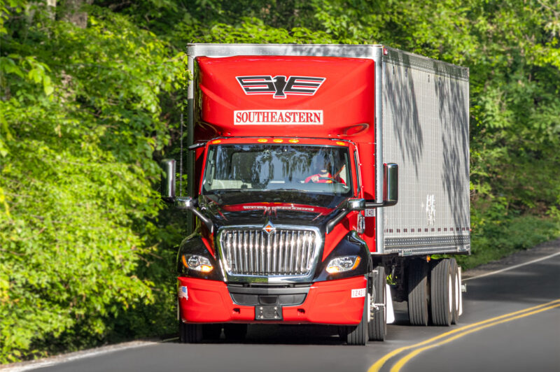 Red International Southeastern Freight Lines truck on the road