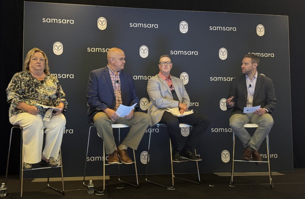 Four people on stage in front of Samsara-branded banner during the panel discussion