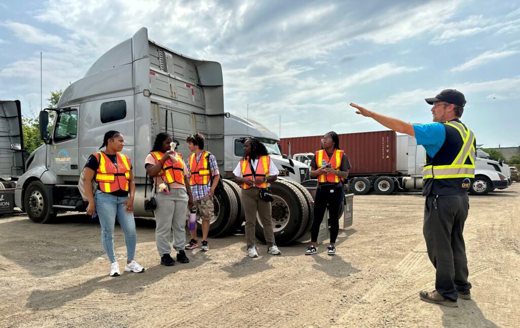 People in a truck yard