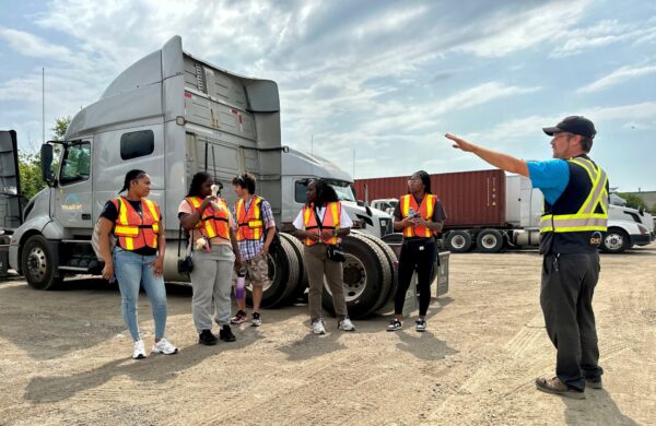 People in a truck yard