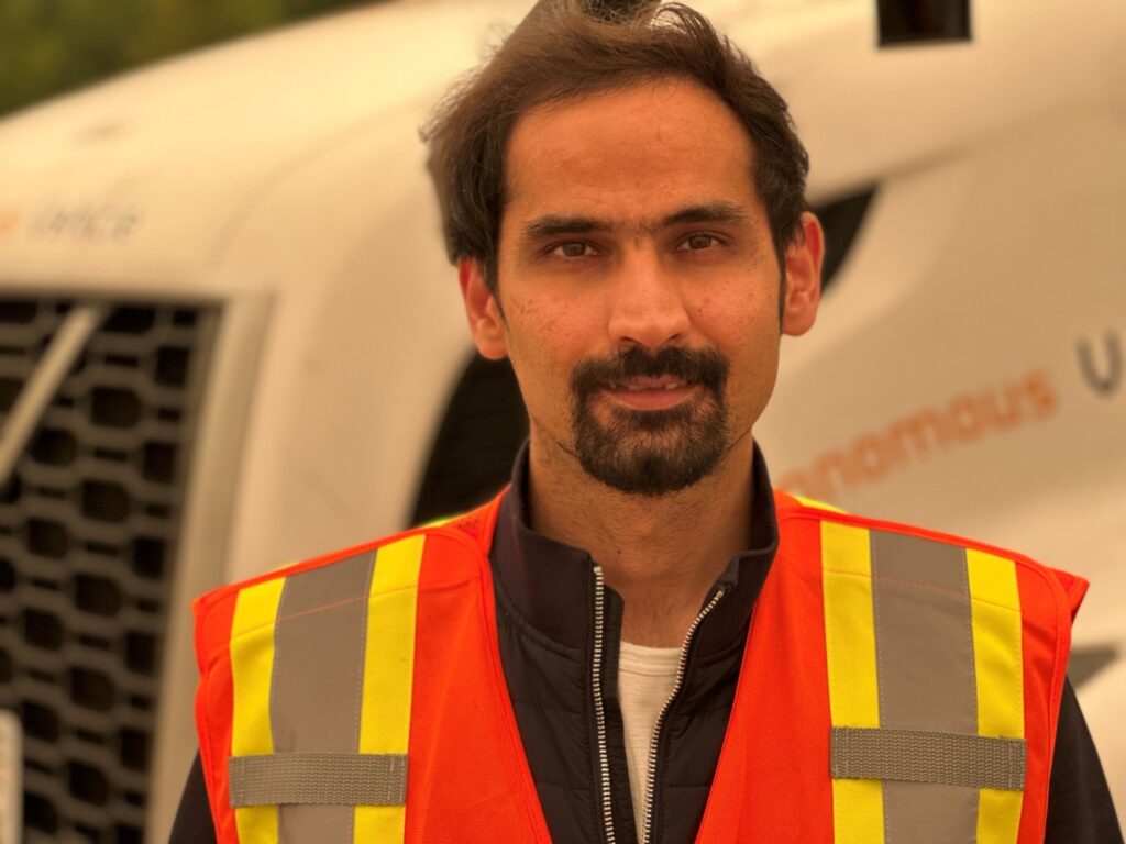 Raghavender Sahdev standing in front of NuPort truck