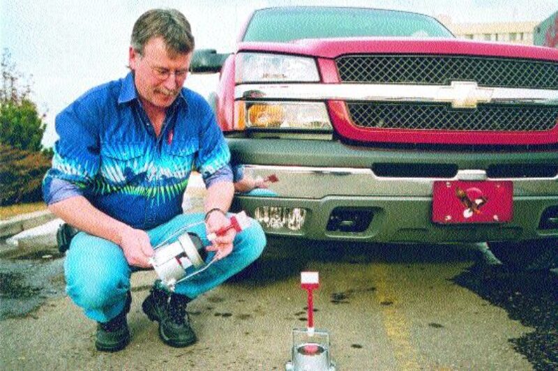 MONEY SAVER: Dale Kromm displays his Savers. An extended bracket is also available for Stemco hubs with wheel meters. Simply attach the bracket to any Stemco hub and keep an eye on them to prevent dragging.Photo by James Menzies