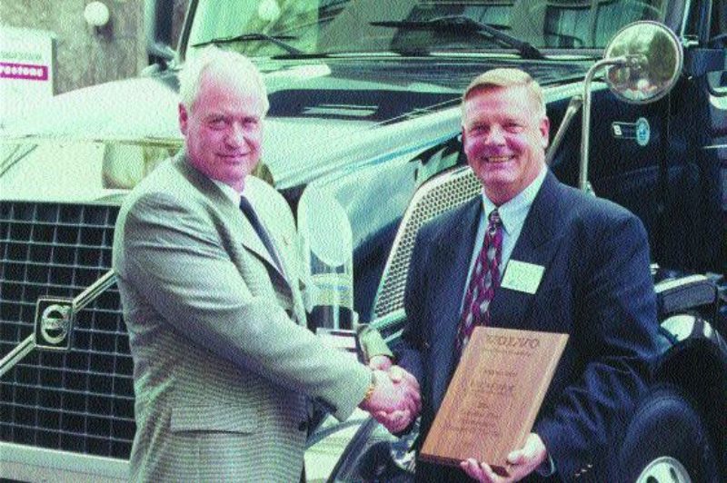 CONGRATULATIONS!: Bill Arthur was recognized as the Canadian Fleet Maintenance Manager of the Year at the recent Canadian Fleet Maintenance Seminar in Toronto. Arthur is pictured here (left) accepting the trophy from Volvo's John Montgomery (right). For this story and in-depth coverage of CFMS, see pages 50-63. Photo by Ingrid Phaneuf