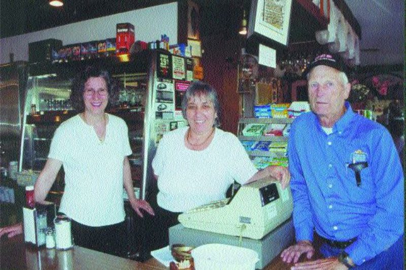 FAMILY VALUES: Pinecrest Restaurant and Truck Stop part owner Kay Nikolakakos (centre) and sister-in-law Angela have been regularly welcoming customers like truck driver Bob Faulkner since the late '60s. The restaurant was one of the first in Toronto where truckers were allowed to park their rigs. Read more on p. 26.Photo by Ingrid Phaneuf
