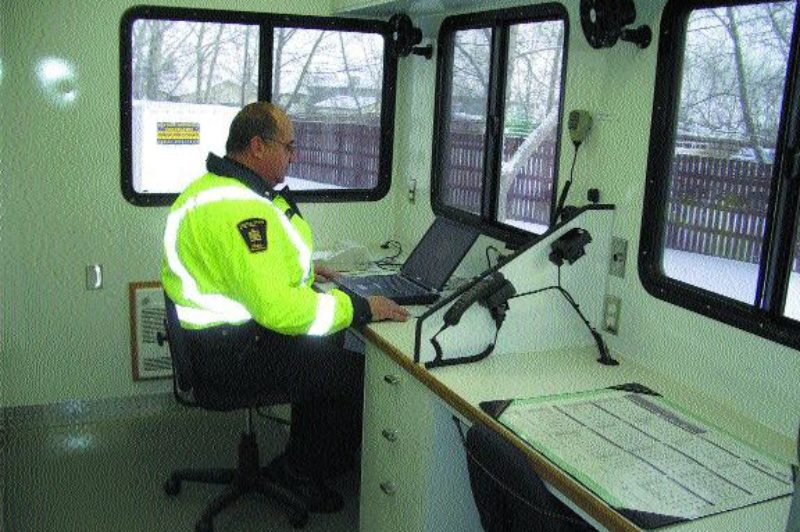 COMMAND CENTRE: Inspector Dale Howard demonstrates the vehicle's many functions.Photo by James Menzies