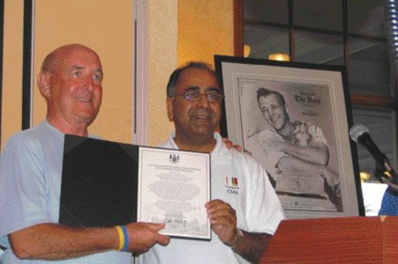 A NEW RECORD: CTA chairman John Cyopeck poses with Harinder Takhar in celebration of the trucking industry's largest single fundraising effort.