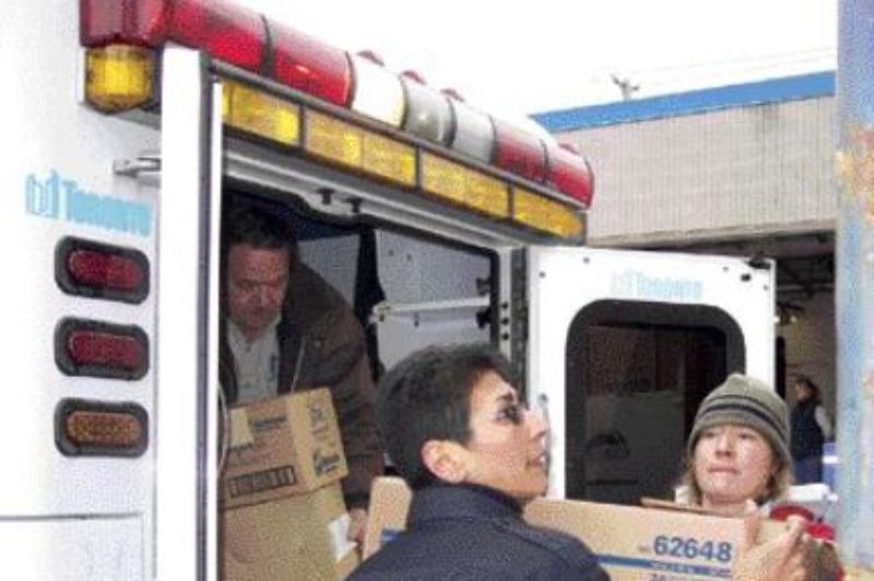 GOOD CAUSE: Volunteers from St. John Ambulance brave the cold to load a tractor-trailer full of medical supplies.Photo by Adam Ledlow