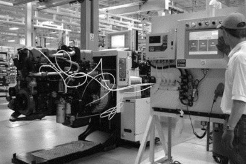 MUCH IMPROVED: An employee at Volvo Powertrain's Hagerstown engine plant performs a leak test on a Mack MP7 engine.