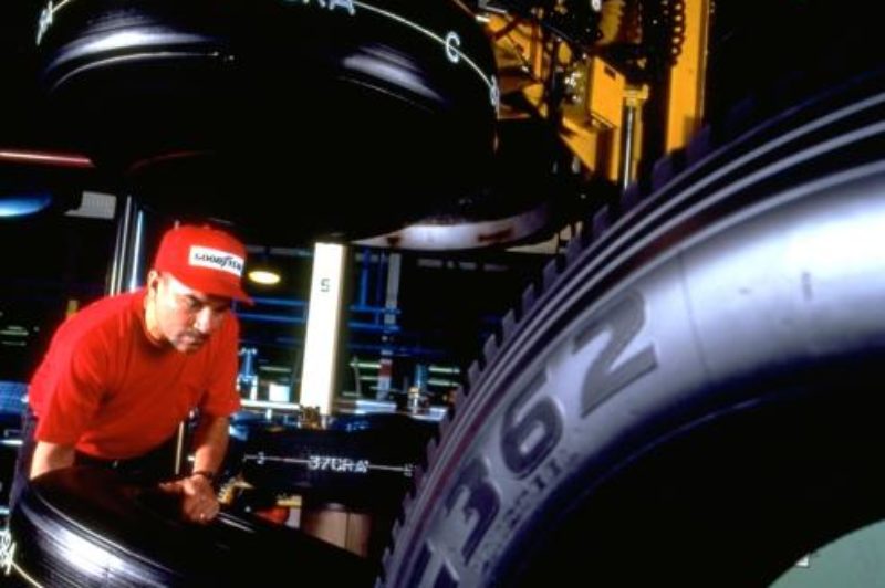 Goodyear medium radial truck tires are prepared for curing at the tire plant in Topeka, Kan. The facility is one of 15 where workers have gone on strike.