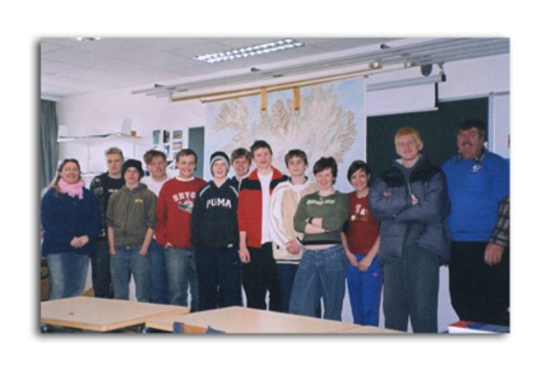 Teacher Sigridur Dua Goldsworthy, far left, and December Trucker Buddy Driver of the Month Bruce Brandon, far right, with the Grade 6 class at Njardvik Elementary School in Iceland.