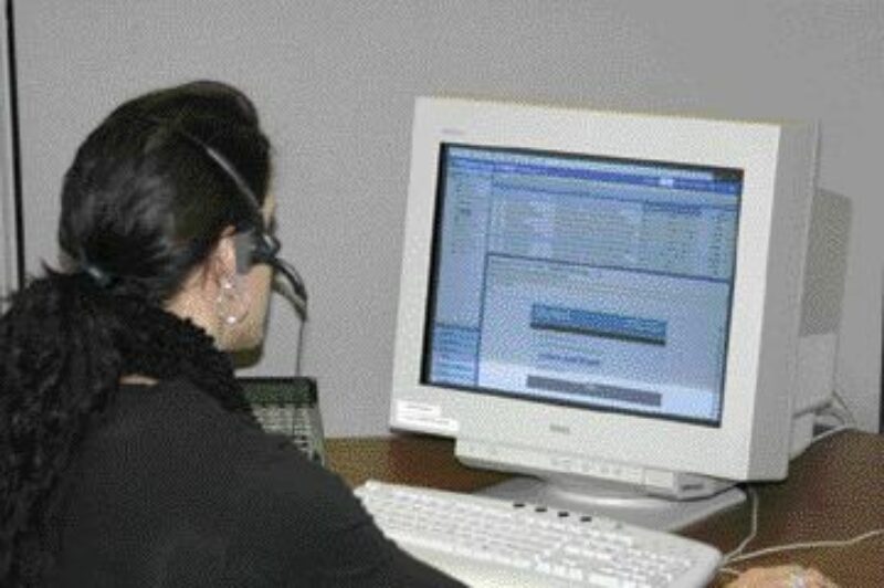 THE SKY'S THE LIMIT: A dispatcher listens to a voice message in her e-mail inbox using the SkyMail solution.