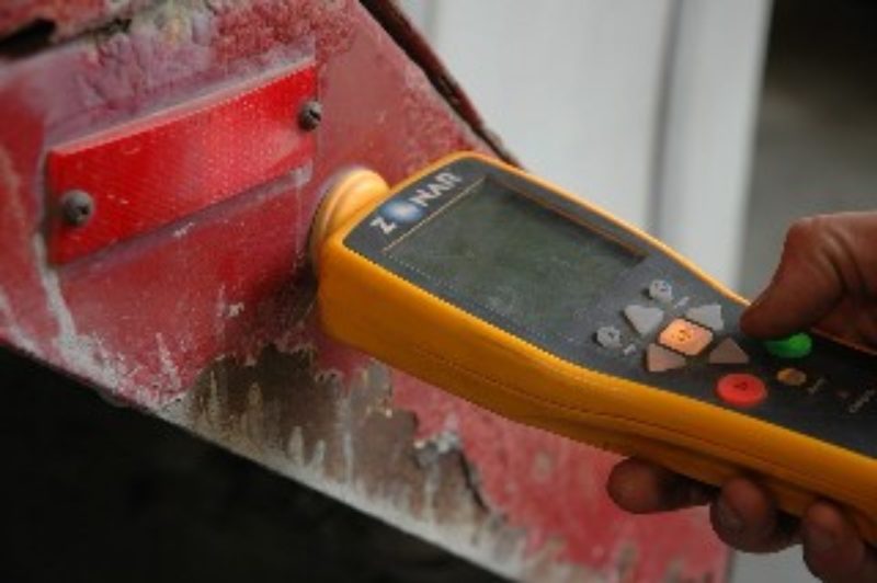 Placing the handheld reader near the RFID tag will notify the driver of items to inspect in that area.