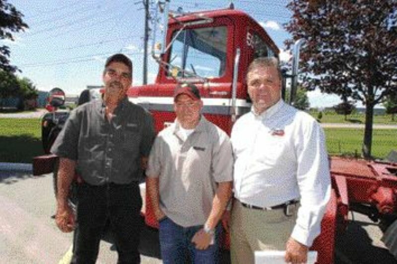 FIRST IN LINE: Tim Atkinson (left) and Mike Yeo (centre) pose with KRTS's Kim Richardson after becoming the industry's first apprentices last summer.