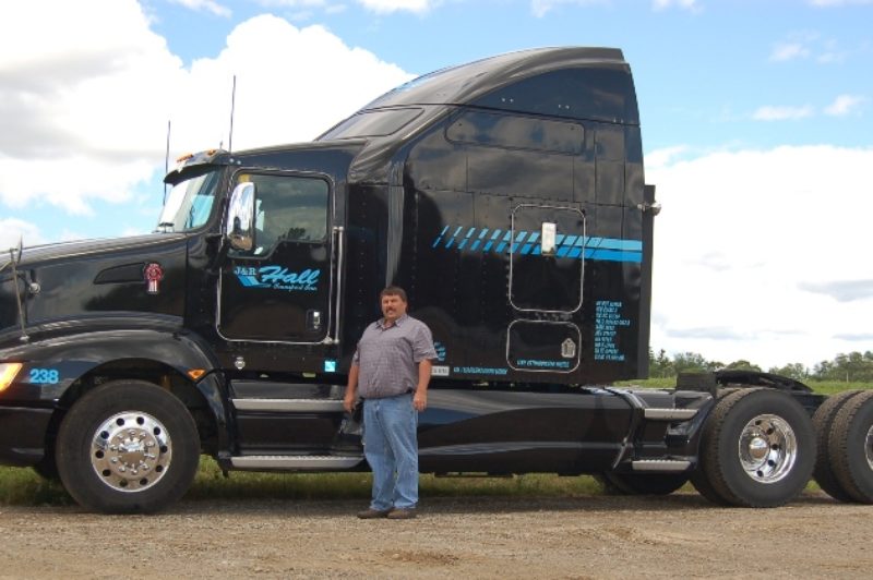 Jeff Hall, president of J&R Hall Transport in Ayr, Ont., with one of his fleet's new Kenworth T660s.