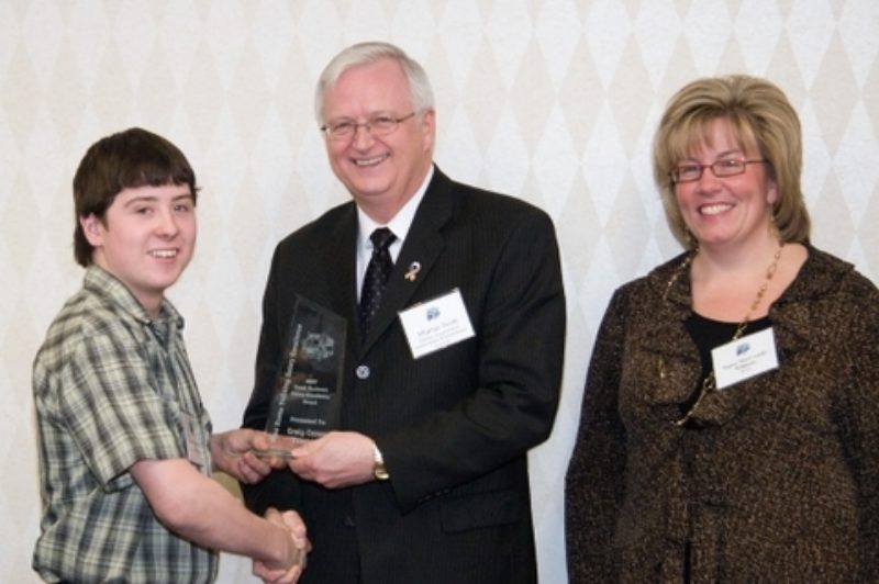 Bradley Crowe, son of Craig Crowe Trucking owner, Craig Crowe, accepts the Small Business Safety Excellence Award on behalf of his father. The awards were presented during the Nova Scotia Trucking Safety Association's annual general meeting in Halifax Feb. 27.