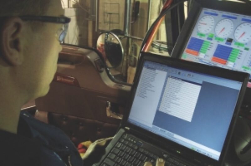 TAMPER PROOF?: Matt Koski of Toromont Cat programs the speed limiter of a truck at 105 km/h.