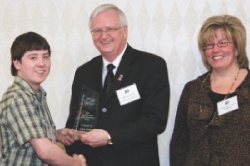 A GOOD CAUSE: Bradley Crowe (left), son of Craig Crowe Trucking owner Craig Crowe, accepts the Small Business Safety Excellence Award on behalf of his father during the recent awards ceremony.