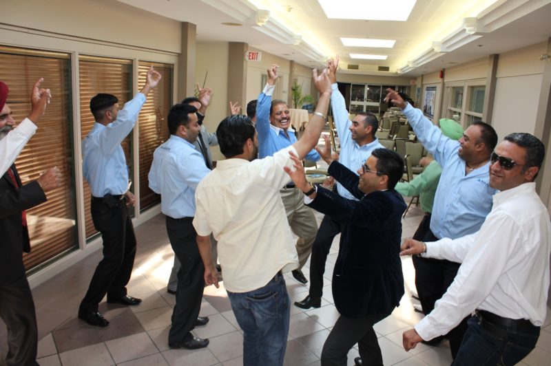 Avaal staff and other attendees celebrate at the grand opening of the company's new facility in Winnipeg July 28.
