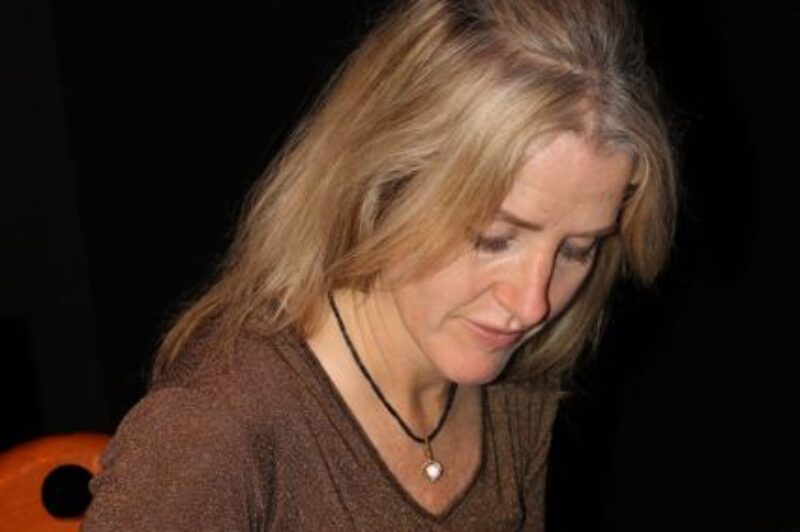 Author Annie Wilder signs a copy of her new book Trucker Ghost Stories.
