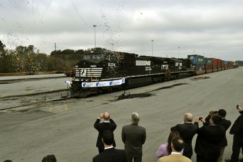 Two Norfolk Southern 4,400-horsepower locomotives break a ribbon during a ceremony celebrating the grand opening of the Georgia Ports Authority James D. Mason intermodal container transfer facility in Savannah, Ga earlier today.