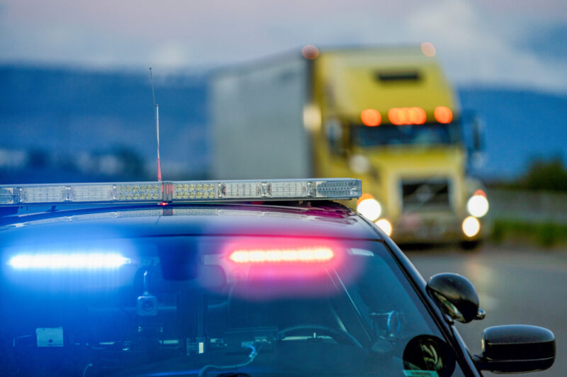 picture of cop car and truck