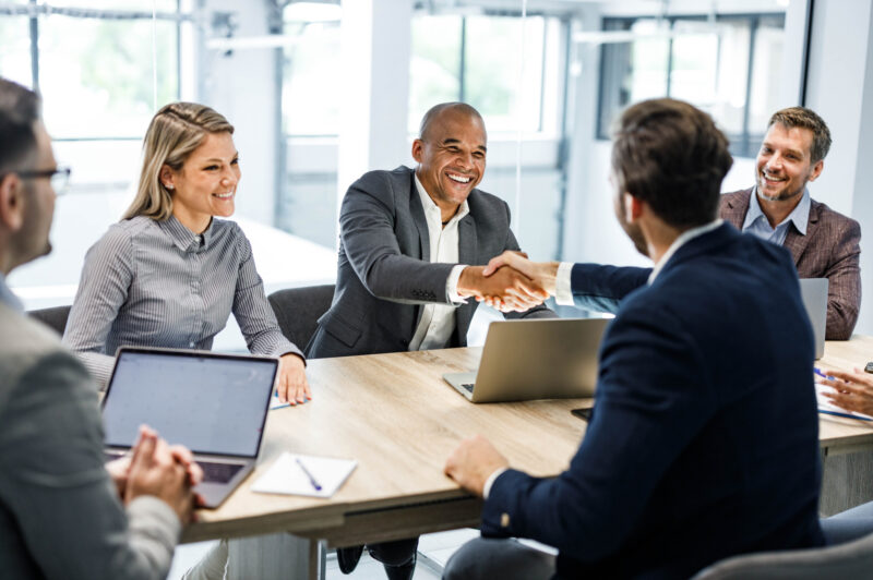 People shaking hands at an office meeting