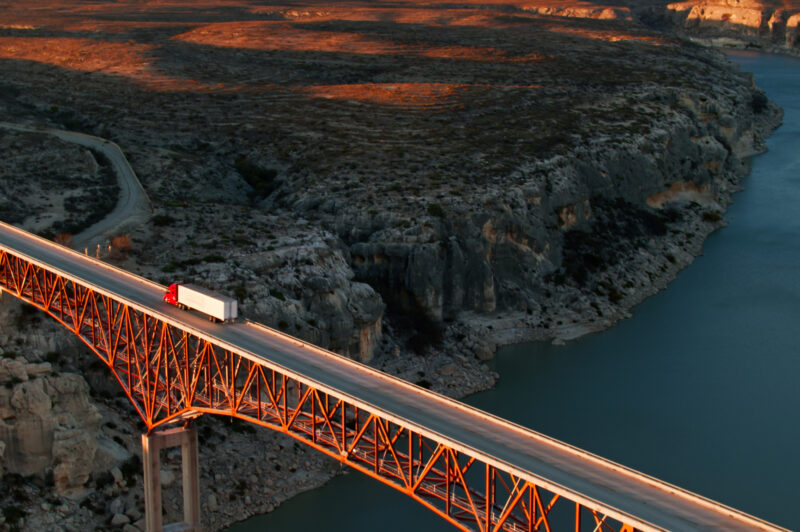 aerial shot of truck on U.S. bridge