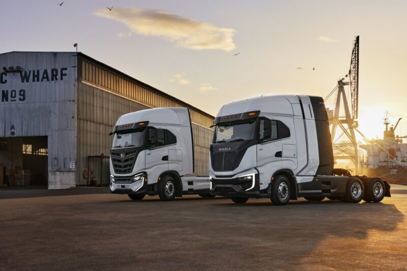Nikola trucks parked on a wharf