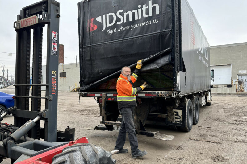 Bruce Leonard of JD Smith is in front of a delivery truck