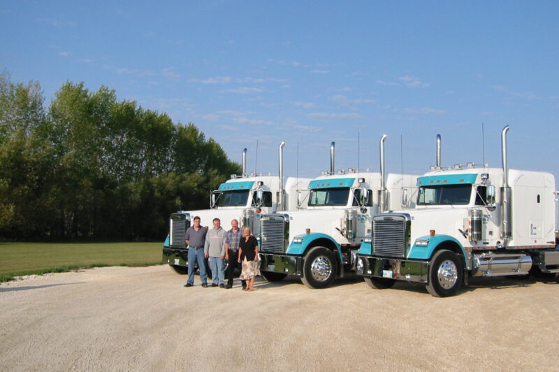Birkett Freight Solutions team in front of the three trucks