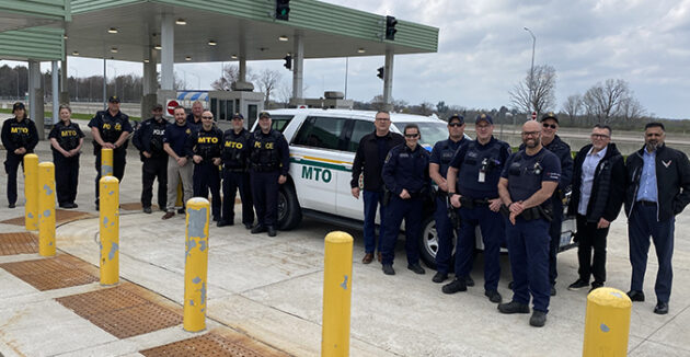 Picture of people standing at a weigh station in Ontario