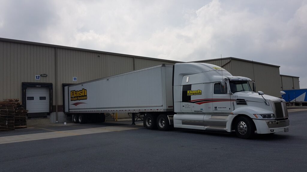 Flash Freight Systems' truck with the company's logo on it