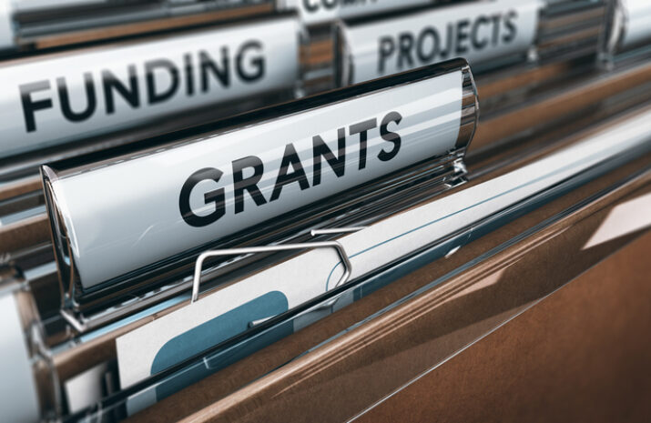 View of brown folders, with focus on grants label, Concept of funding, 3D illustration