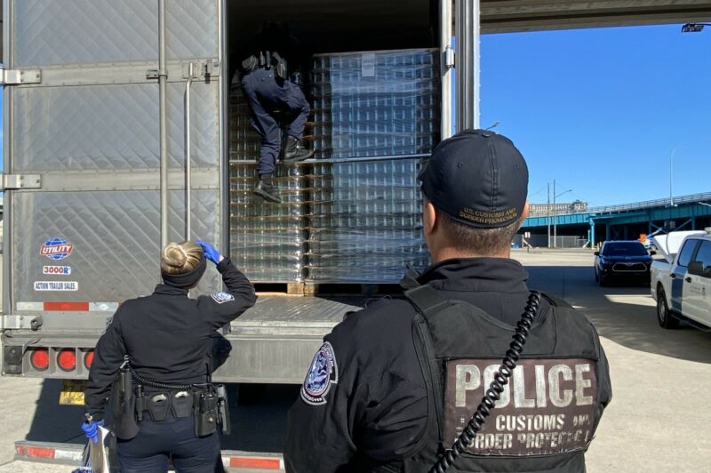 Picture of U.S. officers inspecting a trailer
