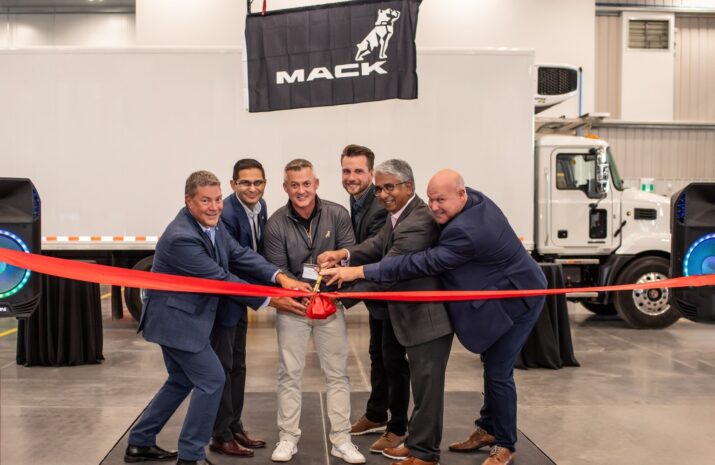 Picture of men cutting a ribbon